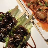 Starters: chicken teriyaki skewers and kimchi  at MakiMaki Sushi Green in Cologne