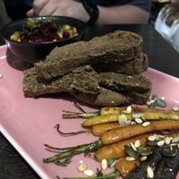 Hummus with bread and roasted carrots at Mooshka in Amsterdam
