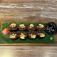 Nori Maki - red rice, marinated tempeh/tofu, carrot, cucumber, rolled in seaweed. Served with wasabi, pickled ginger and soy sauce. at Bodhi Leaf Eatery in Denpasar