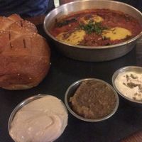 Shakshuka with freshly baked bread and Dips at Four One Six (416) in Tel Aviv