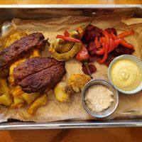 Barbecue. Nothing like U.S. barbecue - no sauce. Patties too salty. Beet root, peppers, horseradish, mustard and potatoes all excellent. at Balans Bistro in Bratislava