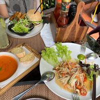 Tomato soup delicious papaya salad and a burger  at Reform Kafe in Chiang Mai