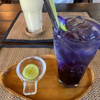 Butterfly pea soda and banana smoothie in the background  at Reform Kafe in Chiang Mai