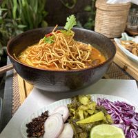 khao soi - northern thai noodle soup with a coconut broth and crispy noodles on top  at Reform Kafe in Chiang Mai