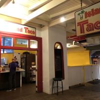 Outdoor seating on right side of restaurant  at Island Taco in Koloa