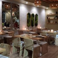 Beautiful seating indoor that opens to outside table's at Harvest Seasonal Grill & Wine Bar in North Wales