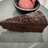 Chocolate truffle cake with raspberry sorbet - lovely  at Bartellas in Meopham
