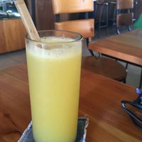 Orange juice with wooden straw - they are conscious about plastic straws 🙂 at Kokkos Cafe Bistro in Diani