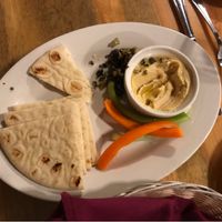 Half eaten plate of hummus at The Rock Inn Mountain Tavern in Estes Park
