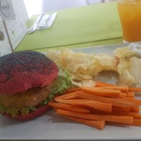 Quinoa and lentil burger with chips and carrot sticks at Vegana Burgers - Cais do Sodre in Lisbon