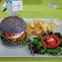 Peanut burger with salad and chips at Vegana Burgers - Cais do Sodre in Lisbon