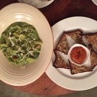 Almond pesto penne with garlic toast.  at Birdsong Organic Cafe Shop in Mumbai