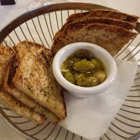 Complimentary bread basket with lemon dressed olives at O'Vrakas Taverna in Limassol