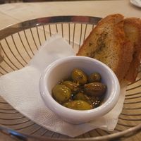 appetizer: toasted bread with olive oil and oregano and green olives on garlic and olive oil at O'Vrakas Taverna in Limassol