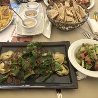 Pumpkin ravioli, pita and dips, salad and chips  at O'Vrakas Taverna in Limassol