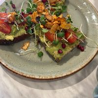 Beautiful avocado toast with pomegranate my favorite at O'YO - Brabantdam in Ghent