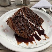Chocolate cake with frosting and chocolate sauce  at Goathland Tea Room & Gifts in Whitby