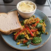 Tofu scramble with toast and grits (CAUTION: grits normally have cheese, order without if vegan) at Early Girl Eatery in Asheville