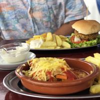 Homemade lasagne and lentil burger  at Cafe Bonjour in Lanzarote