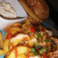 Katsu burger with curly fries at Nice N Sleazy - Old Fashioned Street Food in Glasgow