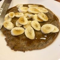 Vegan pancake topped with banana and maple syrup! at 1o9 Cafe in Udaipur