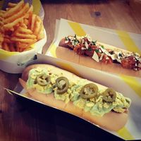 Kickin' Katie Nacho dog and Ticklish Tikka dog with waffle fries at Not Dogs in Birmingham