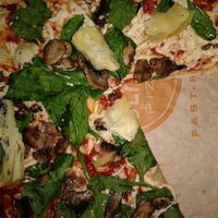 Vegan pizza with spinach, artichoke, and mushrooms at Blaze Pizza in Claremont