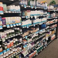 Aisles of supplements at Good Earth Natural Foods in Sandy