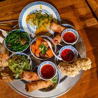 Delivery of first round of small dishes at 1990 Vegan Living at 1990 Vegan Living in Berlin