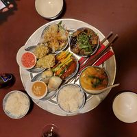 Silken tofu coated with flakes (#3), eggplant, shiitake, tofu (#6), marinated seitan (#10), rice paper rolls (#14), dumplings (#16), red curry (#17) + 2x extra rice (36€) at 1990 Vegan Living in Berlin