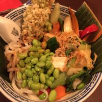 Udon noodles with tofu, seitan and veggies. Flavored with soy sauce and roasted sesame at 1990 Vegan Living in Berlin