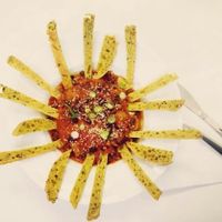 Sausage, passata, black beans and tumeric bread, all homemade from scratch by Chef Mauro at Vegan Yes - Nag's Head Market in North London