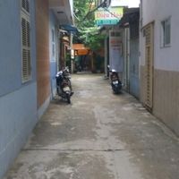 view down alley (with another restaurant on right) at Com Chay - Nguyen Du in Da Nang