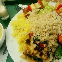 (all vegan) creamy green soup, a spicy coconut milk ";shot"; and on the plate : pumpkin bake (with a peanutty crust), brown rice, couscous, sort of seitan pizza with baked-in veggies, tofu sticks and two kinds of salad  at DaTerra - Bom Sucesso Markt in Porto