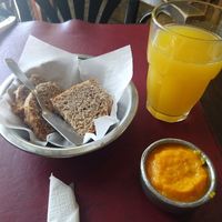 Whole grain bread with squash dipping sauce and a mixed juice drink at Sattva 1 in Buenos Aires
