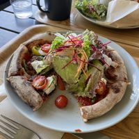 Pizza! WOOPS started eating before photo.  at Love Organics & Birthcafe in Yomitan