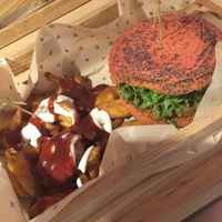 Mamma Mia burger and patatas bravas, drenched in sauce  at Flower Burger in Turin