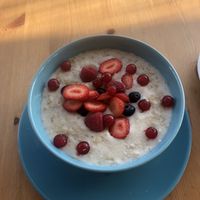 Almond milk porridge with mixed berries! Honestly amazing.  at Organic Cafe in Fuengirola