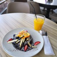 Vegan chocolate cardamon pancakes and orange juice at Organic Cafe in Fuengirola