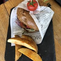 Quinoa chickpea burger with paprika wedges at Organic Cafe in Fuengirola