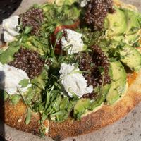 Avocado pizza with the almond cheese was exceptional.   at Urth Caffe in Laguna Beach