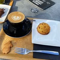 Cappuccino, coco ball (and extra biscuit that came with the coffee, also vegan)  at Kaffabar in Brussels
