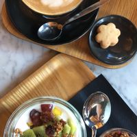 Almond yoghurt + vegan granola and oat milk latte at Kaffabar in Brussels