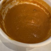 Creamy tomato soup half gone  at True Food Kitchen in Fairfax