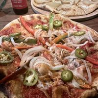 Jackfruit pizza and potato pizza at Luv Burger in Nosara