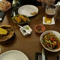 Bread with olive oil and olive paste, vegetables with garlic at Raiz in Porto