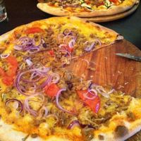 Vegan pizza amore (?? with vegan minced meat, fresh tomato and onions.. and vegan cheese). Very filling and tasty! at Roma Ristorante Pizzeria in Leipzig