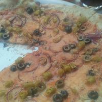 the one with green chilies + garlic and olives  at Pizza Paco in Barcelona