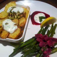 Super tasty dinner we had! Moussaka with aubergine, chickpea, potatoes and sour cream on top. Together with beetroot and green beans.  at Odessa in Amsterdam