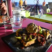 Vegan lasagna and vegan woffle with ice cream and fruit.  at Gelatomania in Gran Canaria